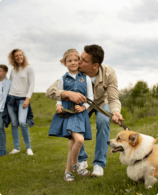 Family with dog outdoors